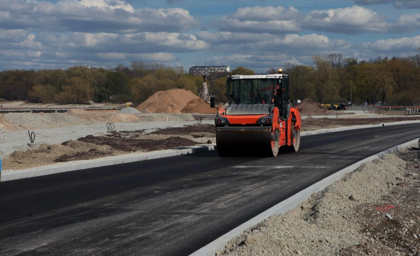 Rolling hot asphalt on new road construction